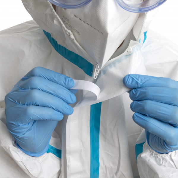 Disposable protective suit. Sealing adhesive tape for lock